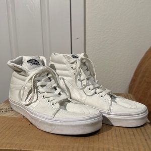 Gently used white high top Vans.